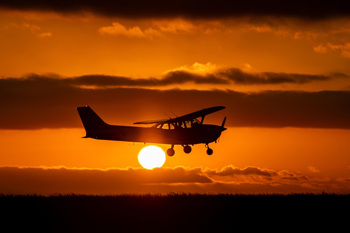 Aircraft flying at sunset